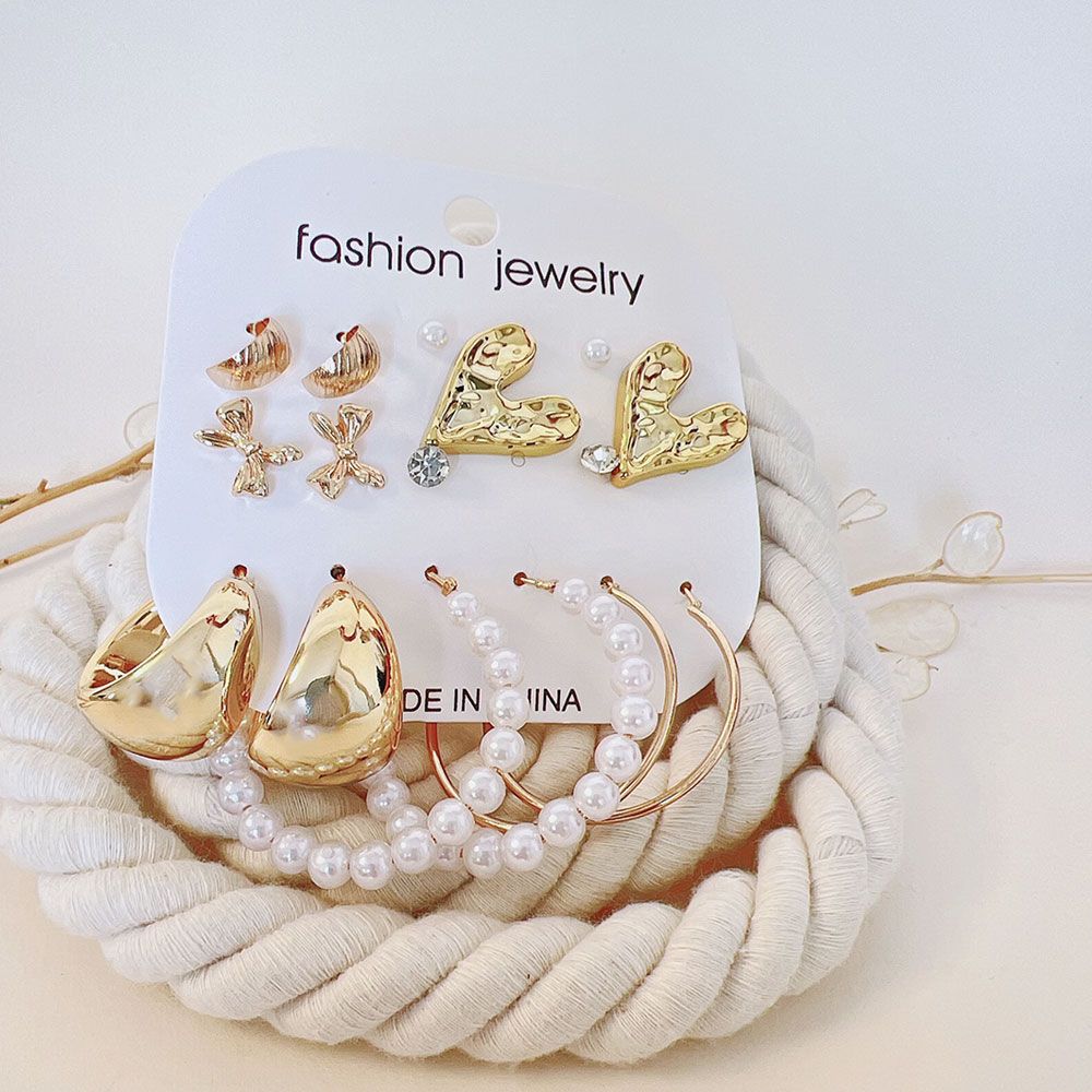 گوشواره پک 8 عددی قلب و پاپیون طلایی