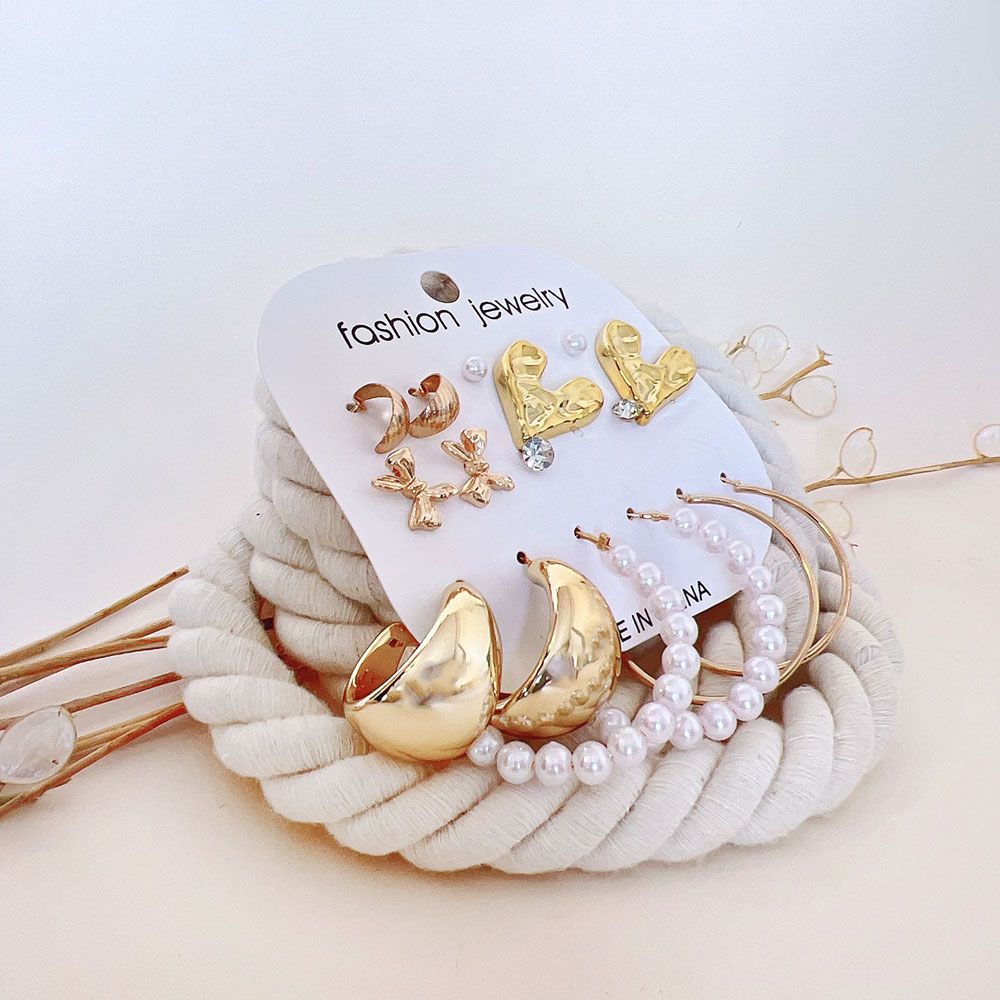 گوشواره پک 8 عددی قلب و پاپیون طلایی